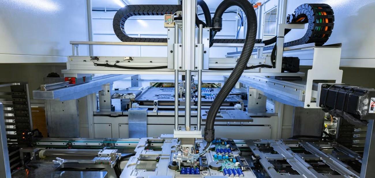 Obsah obrázku stroj/přístroj, inženýrství, průmysl, interiér